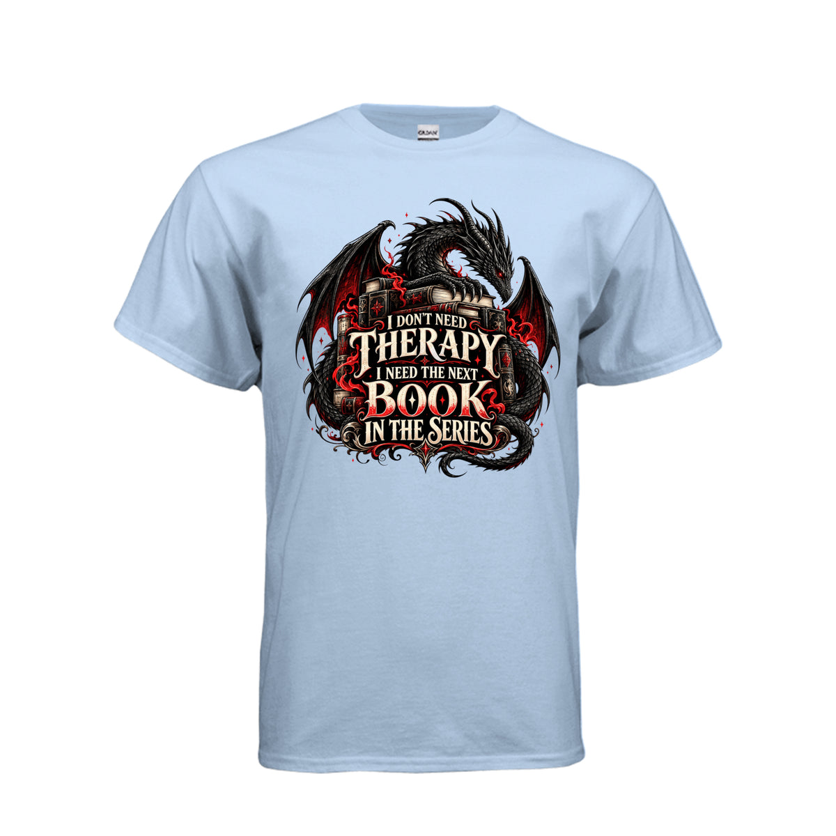Front view of light blue T-shirt featuring a black and red dragon, stacked books, and the quote “I don’t need therapy, I need the next book in the series.”